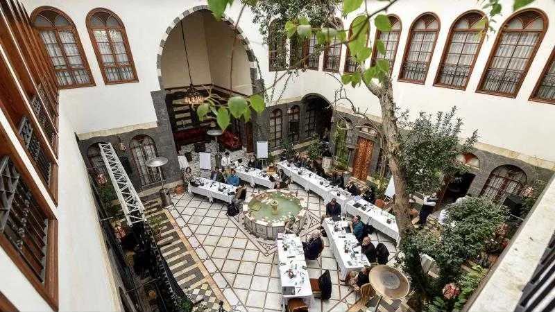 A workshop set in the courtyard of a Damascene house
