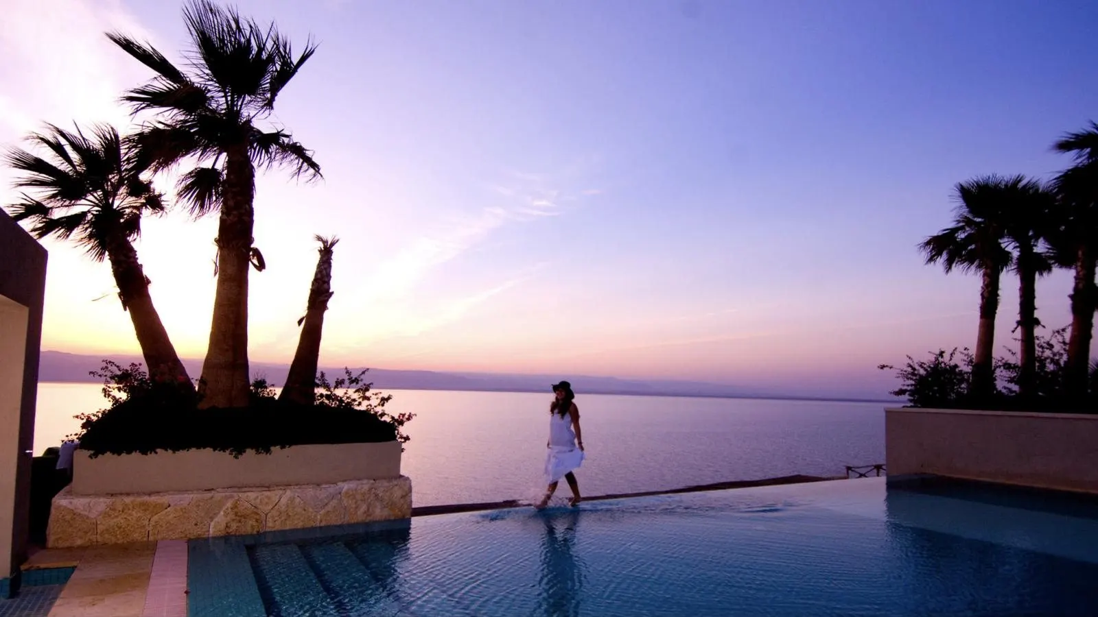 An infinity pool overlooking the Dead Sea at dusk