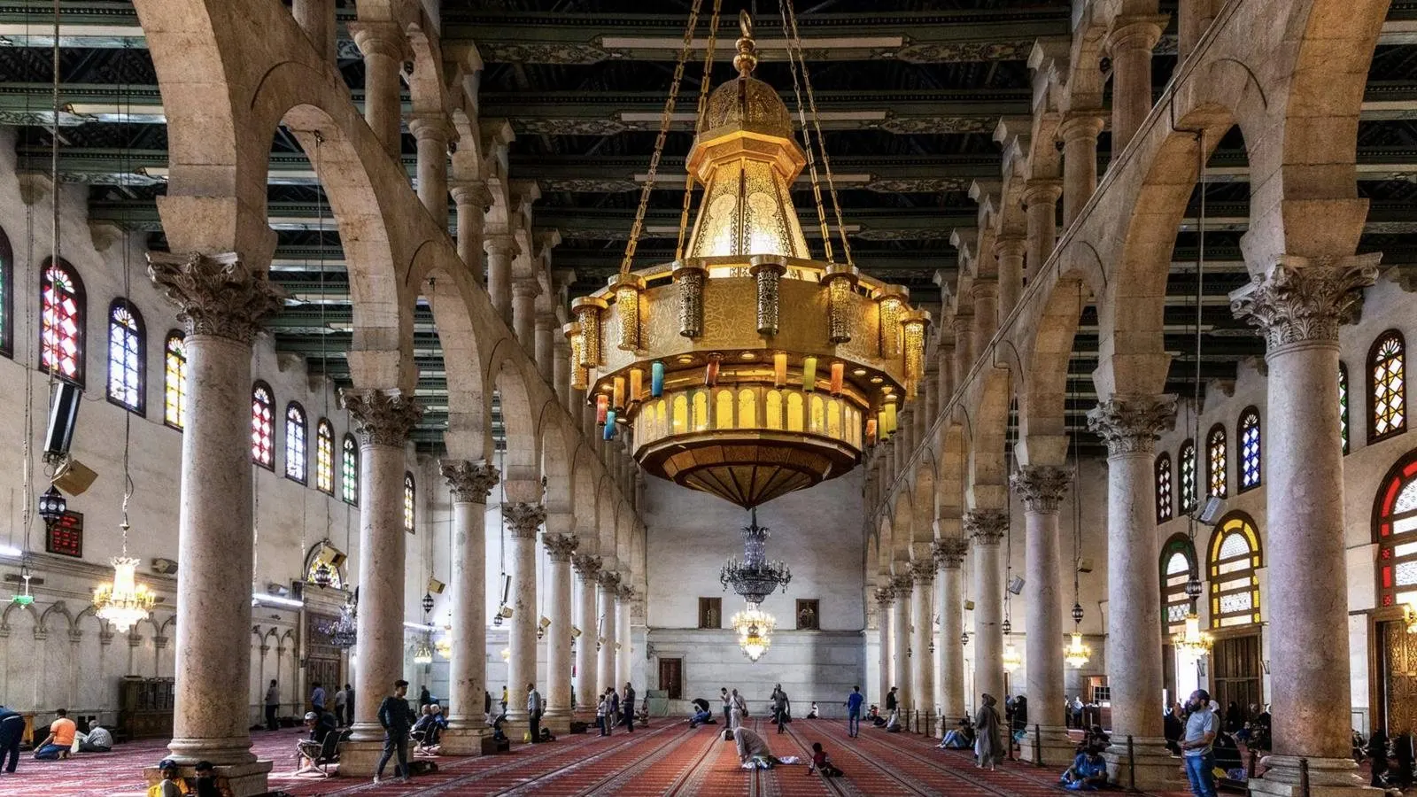 The prayer hall of the Umayyad Mosque with its great golden chandelier