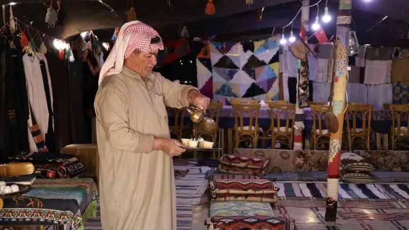 Arabic coffee poured in a traditional tent