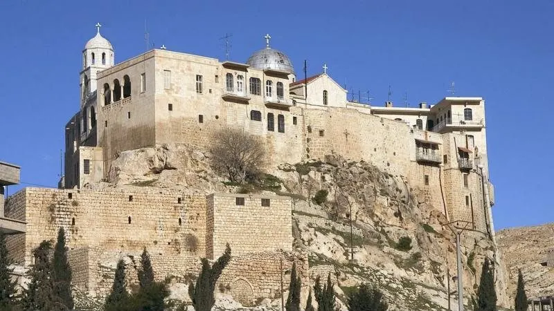 The monastery of Sednaya on its rock above the town
